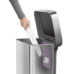 45L rectangular pedal bin with liner pocket with plastic lid - brushed finish - hand taking liner out of liner pocket image